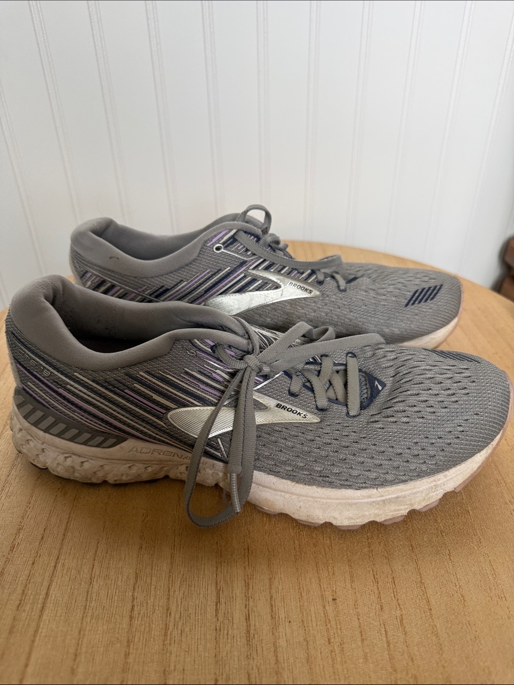 Brooks gray running shoes with purple accents and white midsoles